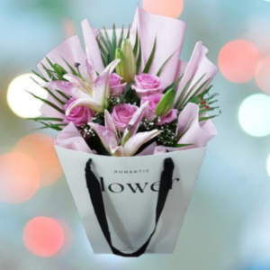 a bouquet of pink flowers in a bag